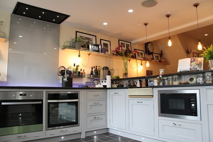 Hand-made kitchen in Oxford with open shelving and the clients' own antique pieces