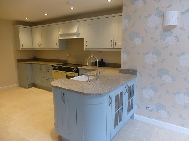 Painted oak kitchen in blue tones with a Belfast sink peninsula in Lower Heyford