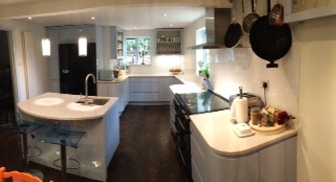 Sky blue gloss kitchen with a curved island sink in Tadmarton